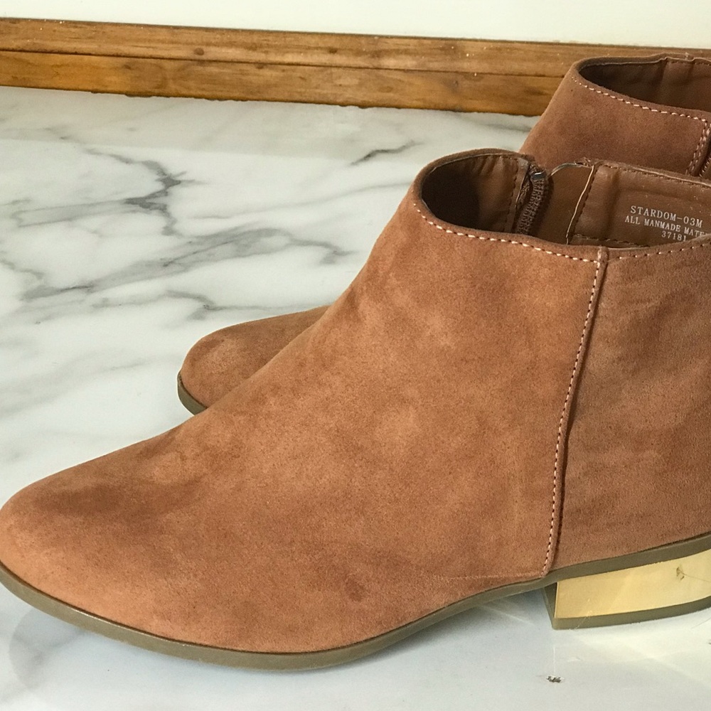 Suede ankle boots with gold tone heel